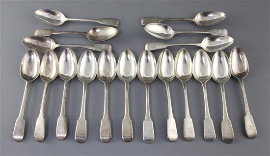 A set of eighteen George III silver fiddle pattern dessert spoons, Eley, Fearn & Chawner, 23.5 oz.